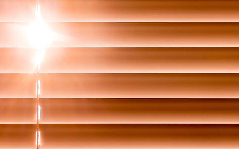 Sun peaking through blinds