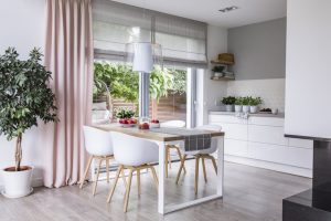 Kitchen with fabric blind and curtain