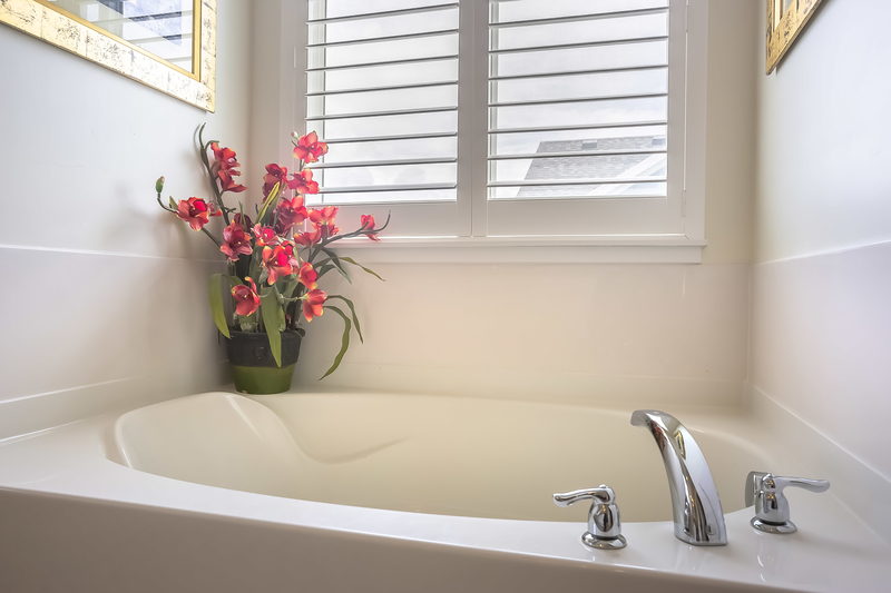 white bathroom and bath tub